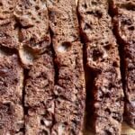 Sliced chocolate sourdough focaccia with crunchy texture and visible chocolate pieces.