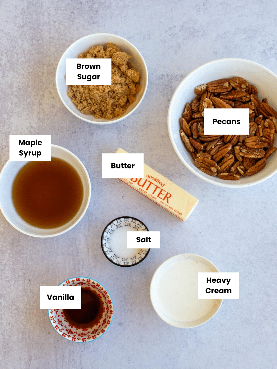 Ingredients for sticky pecan rolls labeled on a countertop.