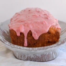 Sourdough discard strawberry bread loaf on a platter.